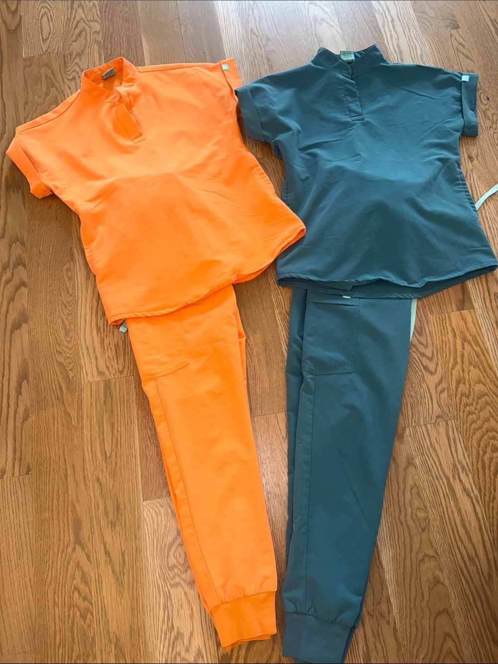 Garde-Malade Women's Two-Piece Jogger Scrub Set in Bright Orange and Teal